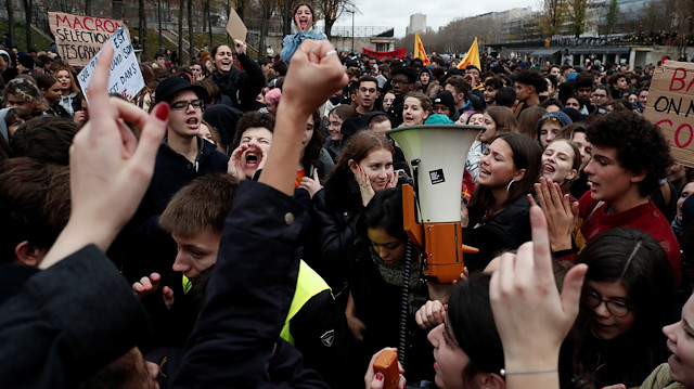 Youths and high school students attend a demonstration to protest against the French government's reform plan, in Paris, France, December 7, 2018. 