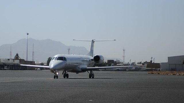 A plane carrying aid workers taxies upon arrival at the Sanaa airport, Yemen