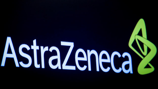 Logo of Astra Zeneca is displayed on a screen on the floor