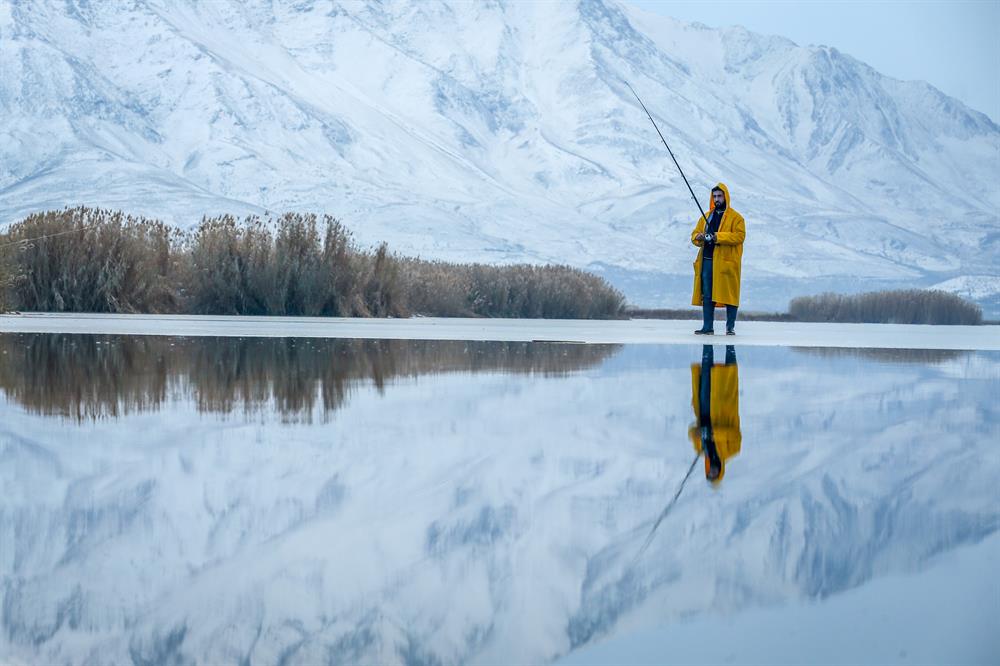 Fishing on frozen lake in Van