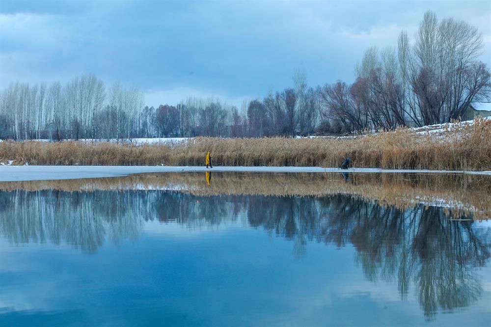 Fishing on frozen lake in Van