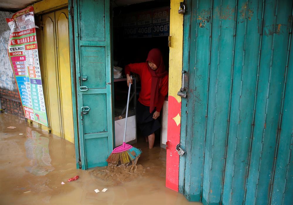 Jakarta embraces flood after heavy rain
