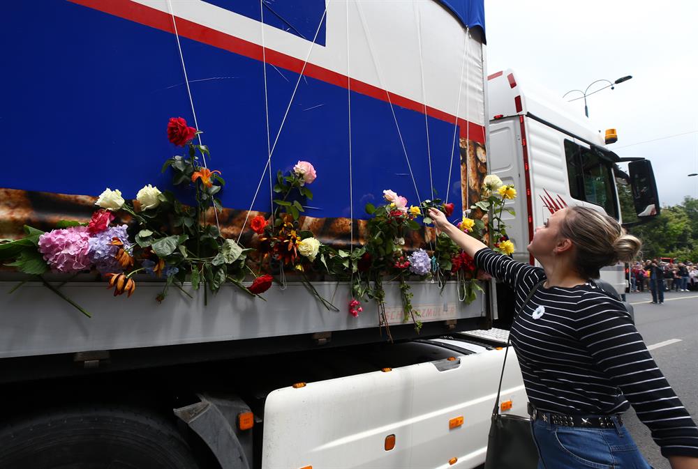 Bosnians honor Srebrenica victims with flowers and tears