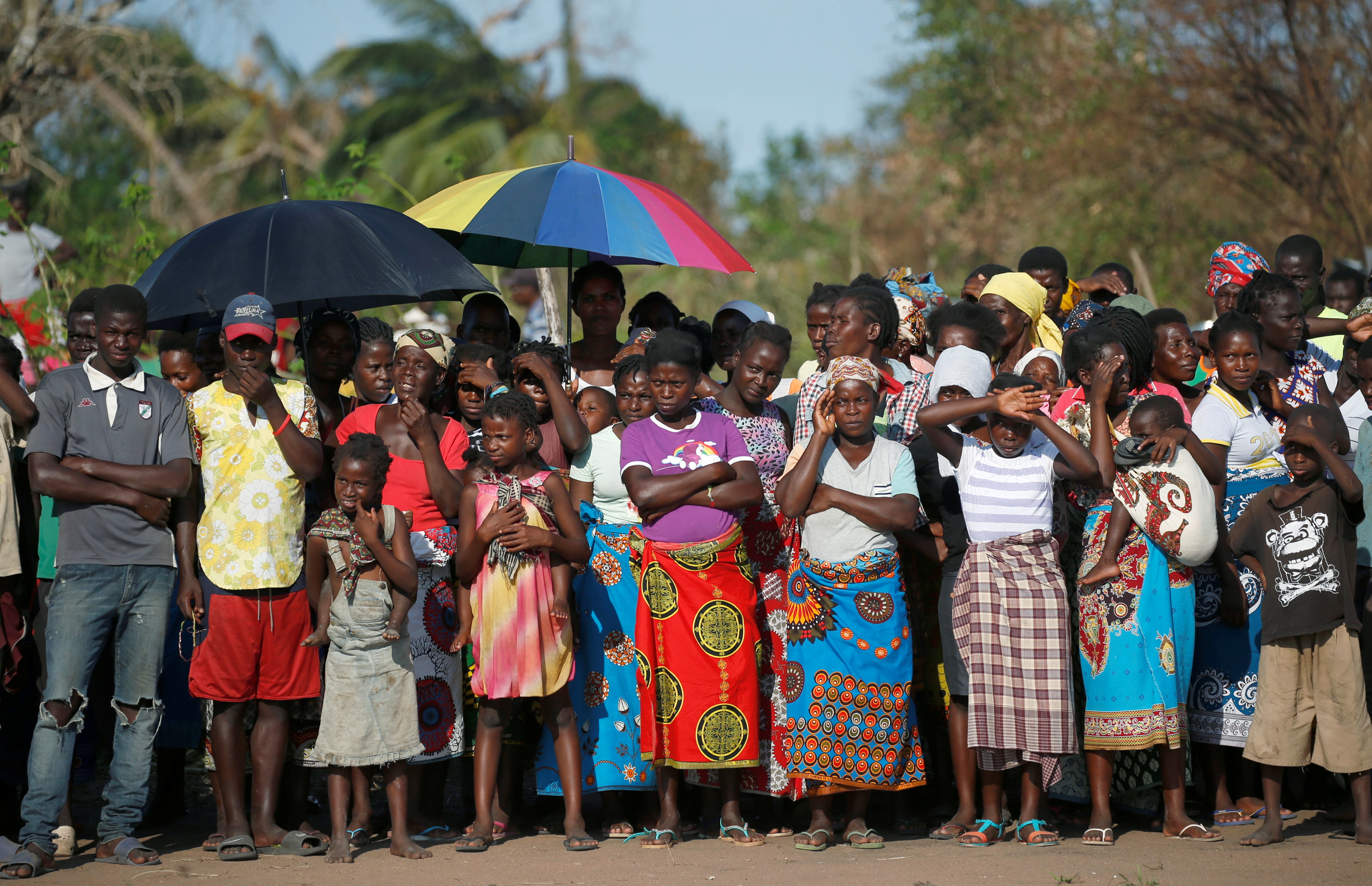People wait for food aid in the aftermath of Cyclone Idai
