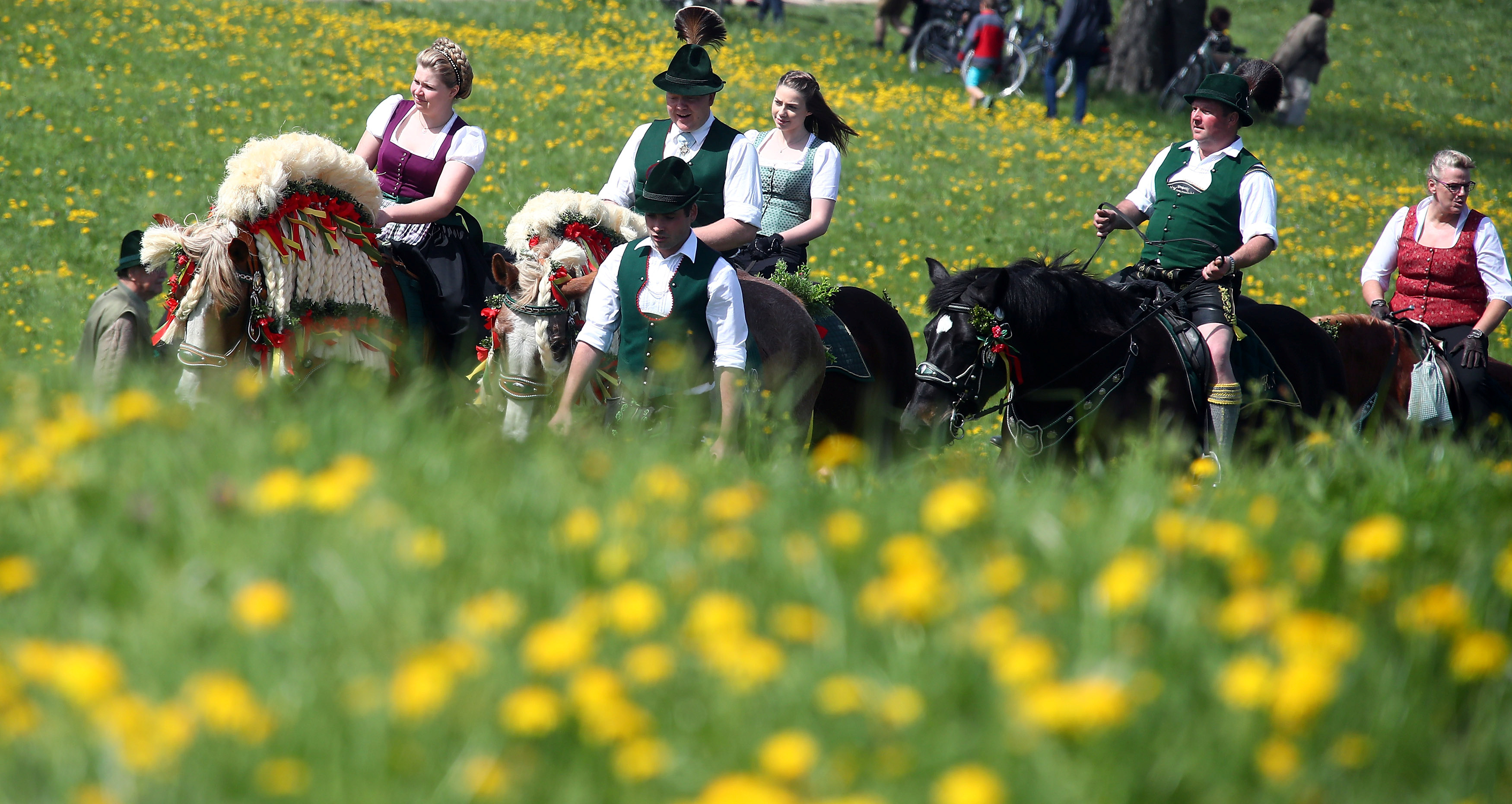 Pilgrims dressed in traditional clothes attend Georgi horse riding procession in Traunstein
