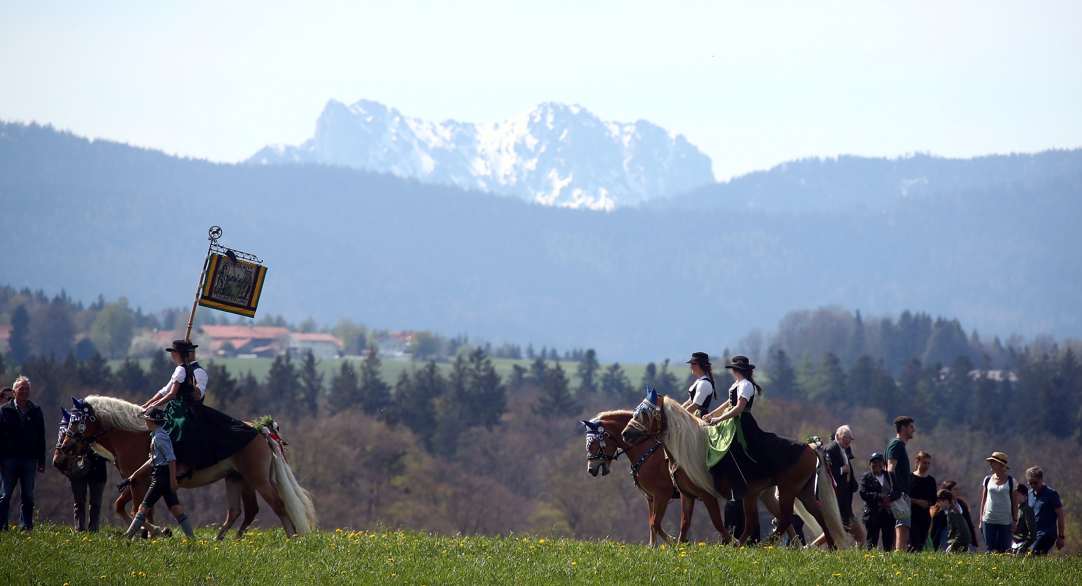 Pilgrims dressed in traditional clothes attend Georgi horse riding procession in Traunstein
