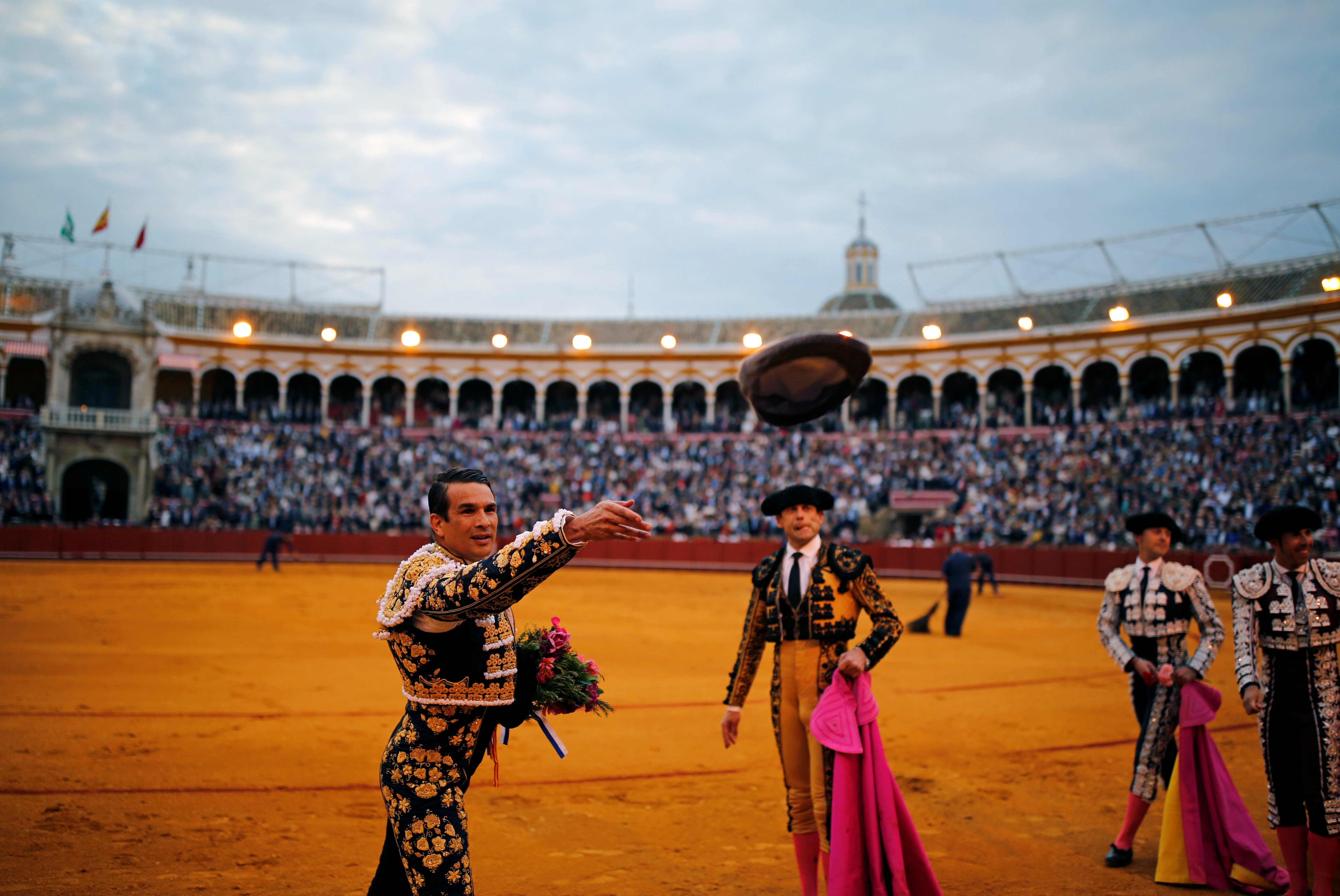 Famous matadors perform talents during a bullfight in Seville