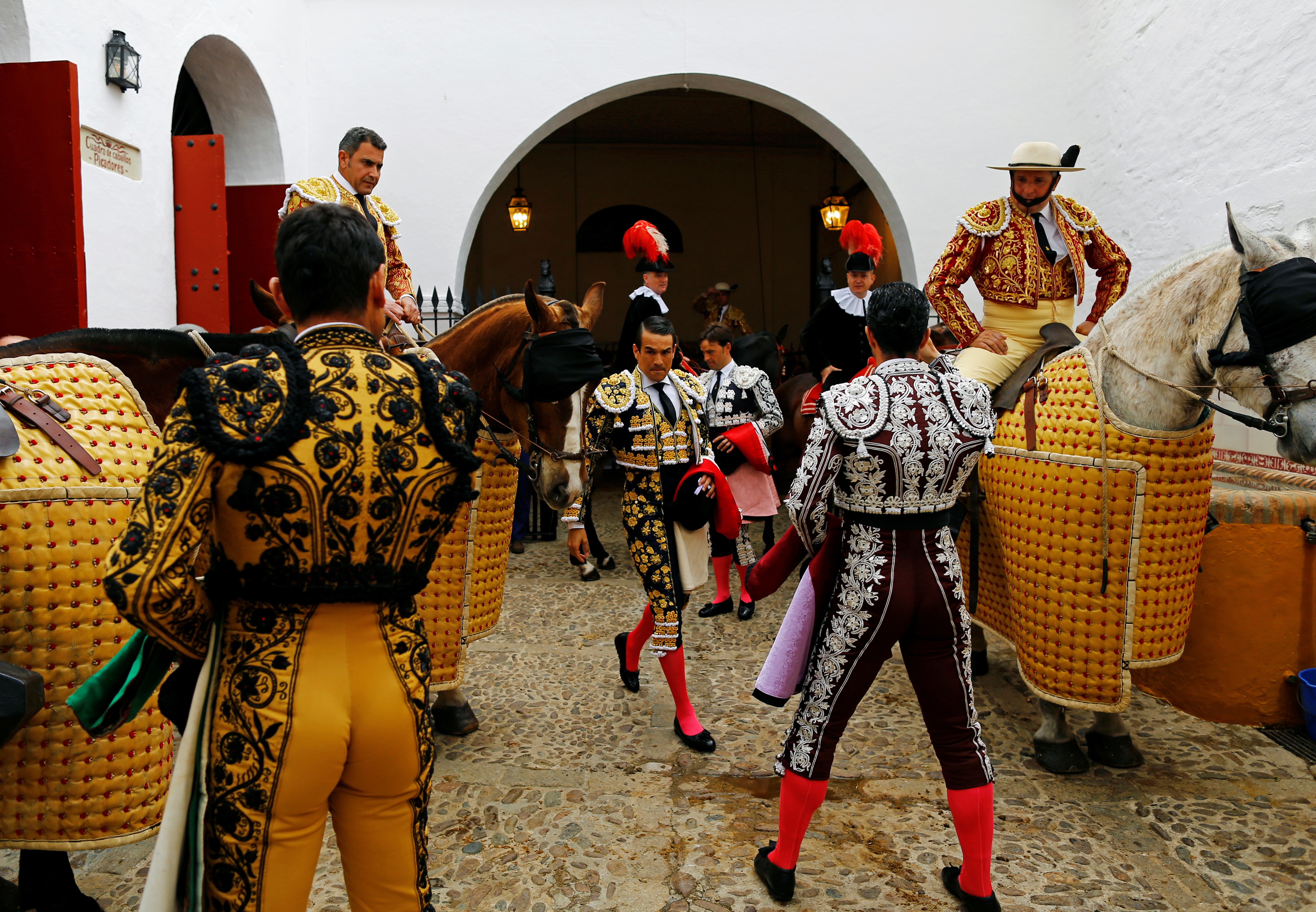 Famous matadors perform talents during a bullfight in Seville