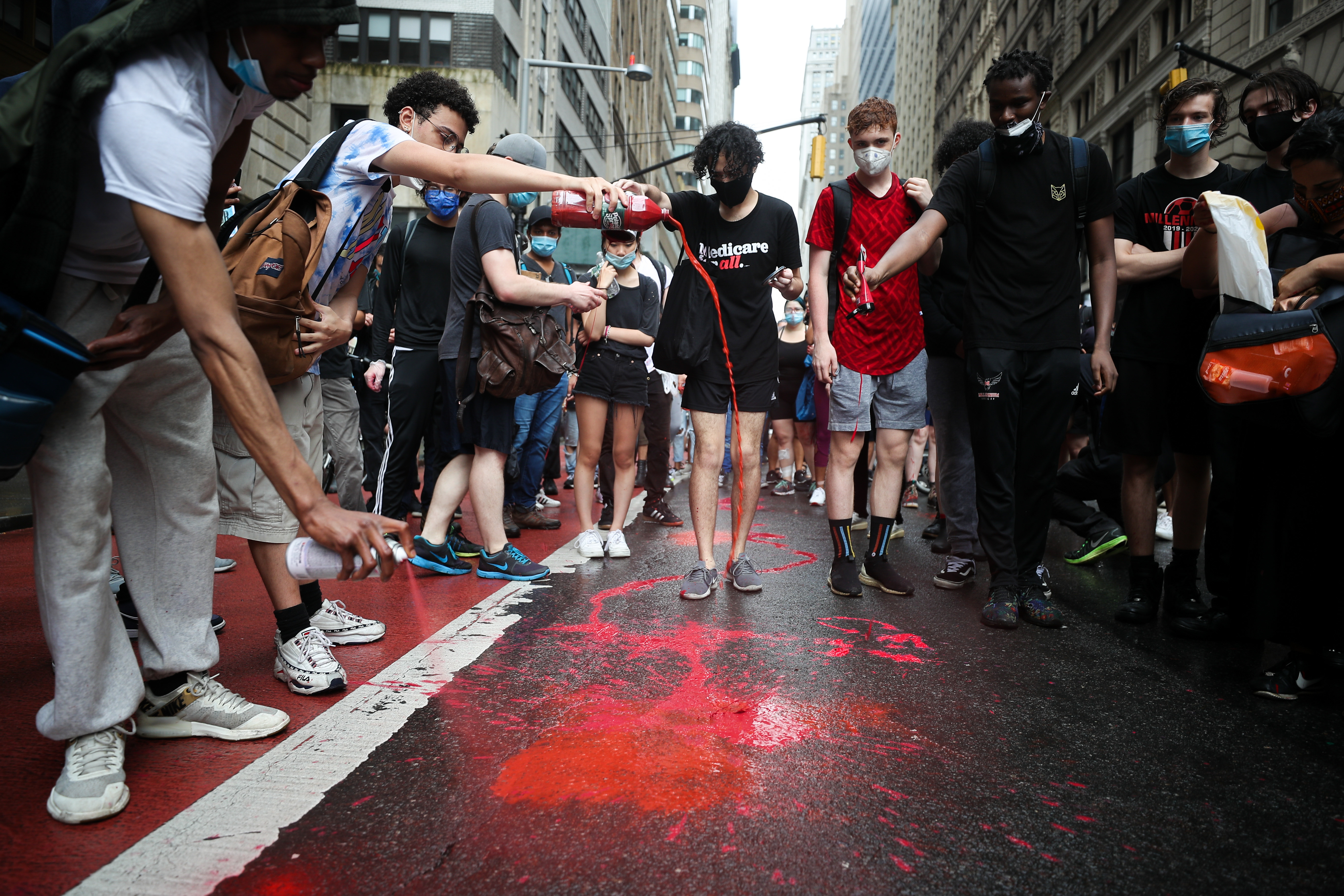 'Black Lives Matter' protestors spill red paint on streets in Financial District in NYC